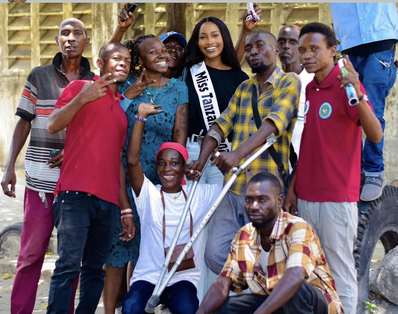 Miss Tanzania with a group of community members during an outreach visit