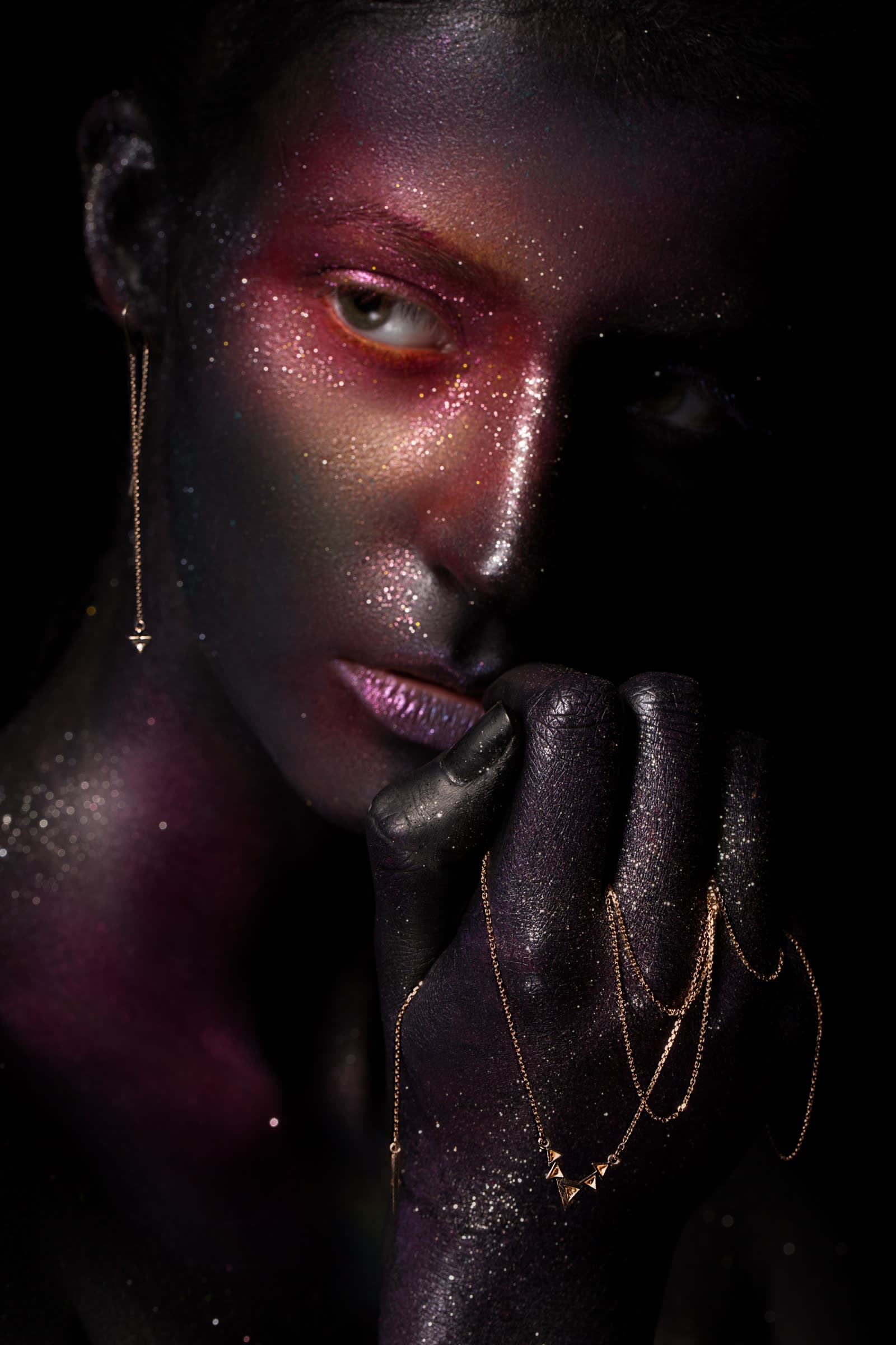 Portrait with glitter makeup and gold chains